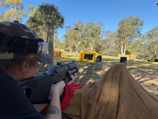 Player aiming at Cottermouth with open terrain and bunkers