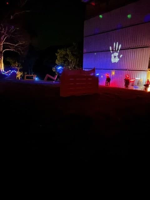 Night field session with coloured lights and players