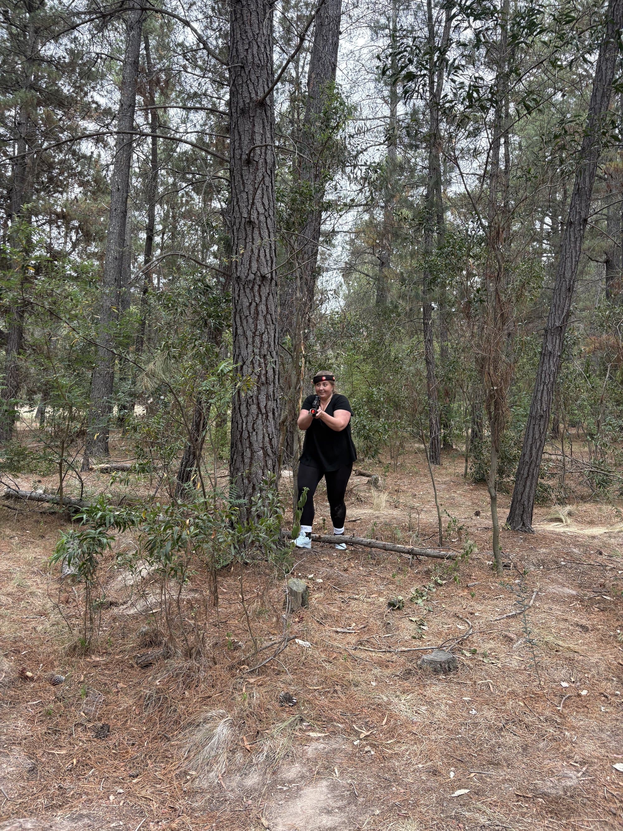 Player taking cover behind a tree at Fadden Pines
