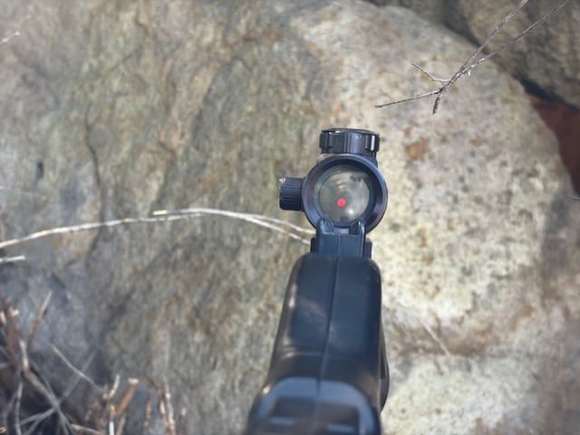 Aiming down the red dot scope on an FSLT gun